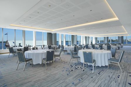 Conference room with round tables and chairs.
